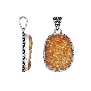 Sterling silver oval pendant with golden Druzy Quartz and ornate Balinese bezel detailing.