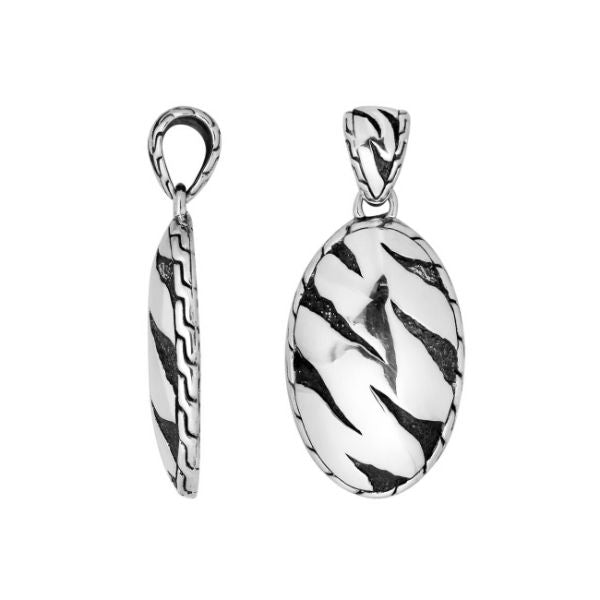 Wholesale sterling silver oval pendant with abstract carved black pattern.