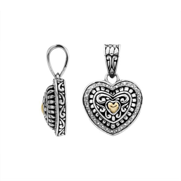 Sterling silver heart pendant with diamond and 18K gold detailing in ornate design.