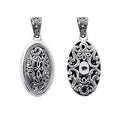 A wholesale Silver Overlay Over Copper oval pendant featuring intricate Balinese filigree detailing, oxidized depth, ornate scrollwork, and polished silver highlights ideal for bulk jewelry buyers.