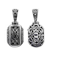 A wholesale Silver Overlay Over Copper oval pendant featuring ornate Balinese scrollwork, oxidized detailing, polished highlights, and a refined silver overlay design ideal for bulk jewelry buyers.
