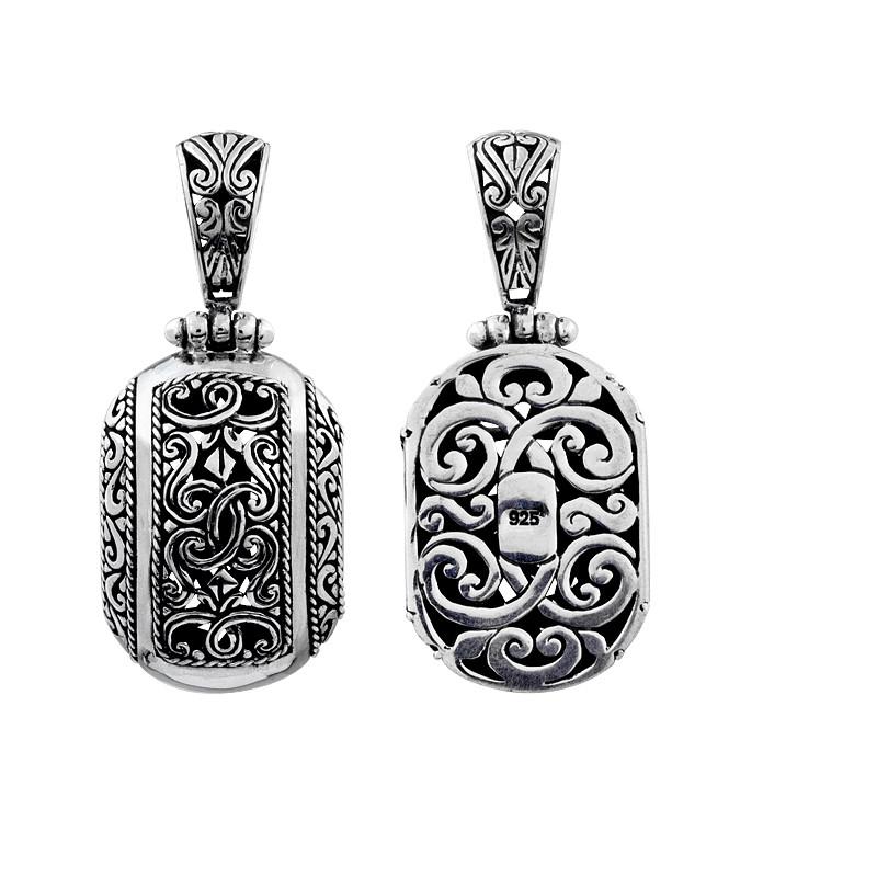A wholesale Silver Overlay Over Copper oval pendant featuring ornate Balinese scrollwork, oxidized detailing, polished highlights, and a refined silver overlay design ideal for bulk jewelry buyers.