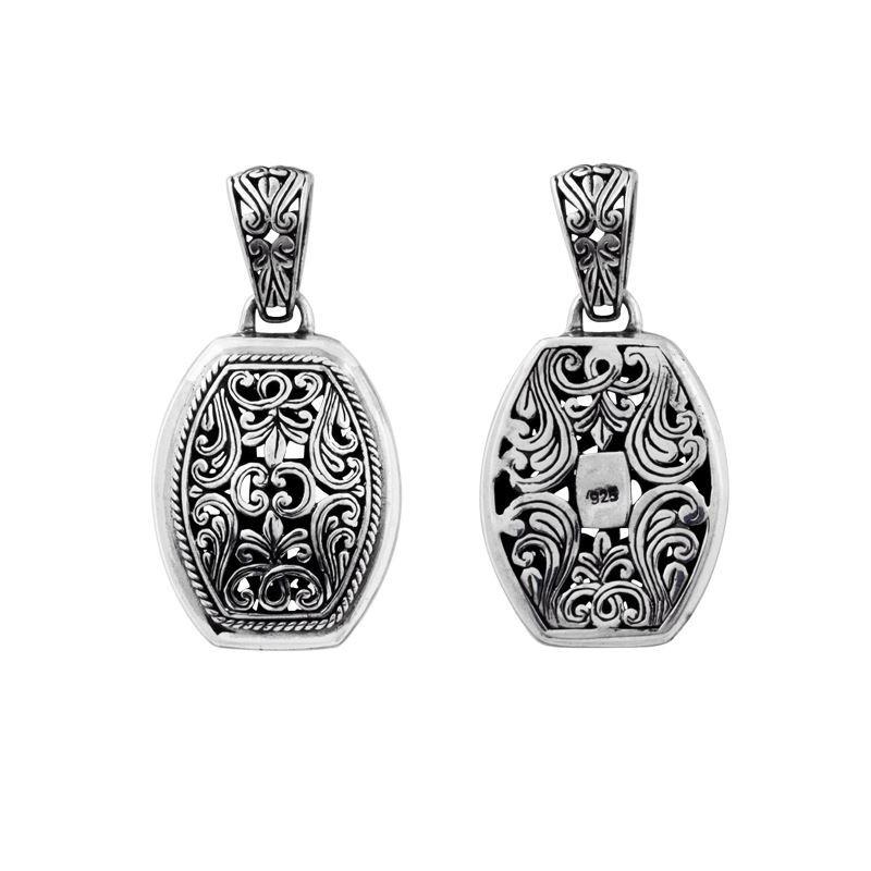 A wholesale Silver Overlay Over Copper oval pendant featuring detailed Balinese scrollwork, oxidized antique textures, polished overlay accents, and traditional filigree artistry ideal for bulk jewelry buyers.