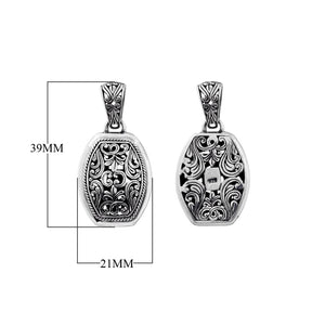 A wholesale Silver Overlay Over Copper oval pendant featuring detailed Balinese scrollwork, oxidized antique textures, polished overlay accents, and traditional filigree artistry ideal for bulk jewelry buyers.
