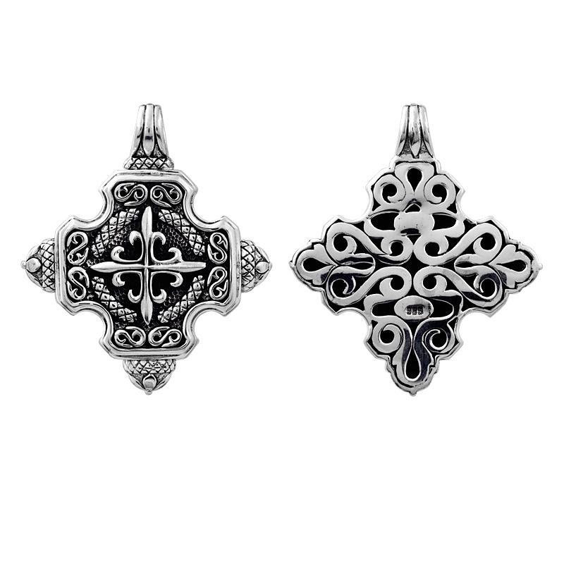 A wholesale Silver Overlay Over Copper fancy cross-shaped pendant featuring detailed Balinese scrollwork, oxidized textures, raised artisan detailing, and polished overlay craftsmanship ideal for bulk jewelry purchasing.
