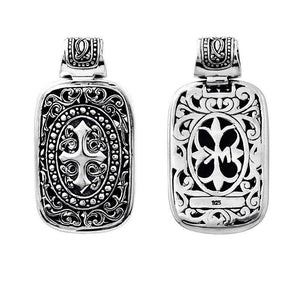 A wholesale Silver Overlay Over Copper rectangular pendant featuring deep oxidized Balinese scrollwork, raised detailing, polished overlay texture, and traditional craftsmanship ideal for bulk jewelry buyers.