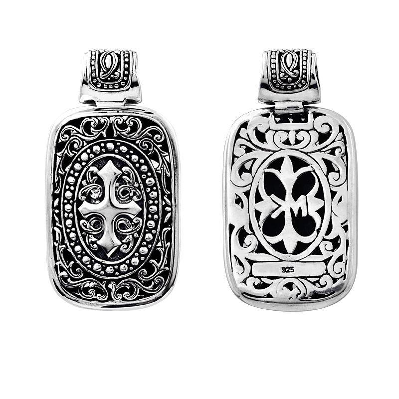 A wholesale Silver Overlay Over Copper rectangular pendant featuring deep oxidized Balinese scrollwork, raised detailing, polished overlay texture, and traditional craftsmanship ideal for bulk jewelry buyers.