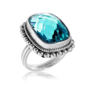 Sterling silver wholesale ring with cushion-cut faceted blue Topaz Quartz, rope bezel, and beaded border design, handcrafted in Bali.