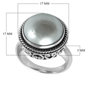 Wholesale sterling silver mother of pearl ring with polished cabochon stone, rope bezel, and Balinese scroll detailing – handcrafted artisan jewelry from Bali.