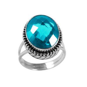 Wholesale sterling silver ring with faceted oval Blue Topaz Quartz, Balinese beaded border design – bulk handcrafted statement jewelry.