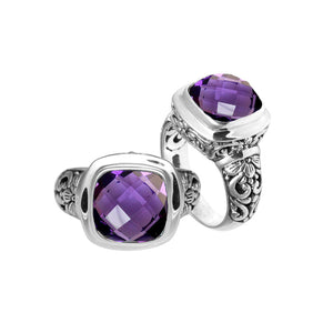 Sterling silver ring with cushion-cut Amethyst Quartz and Balinese carvings.