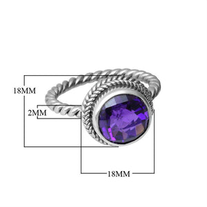 Sterling silver ring with a round Amethyst Quartz and rope-style band design.