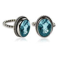 Sterling silver oval Blue Topaz Quartz ring with bezel setting and rope-style band design.