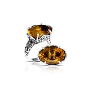Sterling silver statement ring with oval Citrine Quartz and Balinese scrollwork handcrafted in Bali.