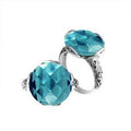 Sterling silver ring with faceted round Blue Topaz Quartz and Balinese scrollwork handcrafted in Bali.