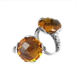 Sterling silver ring with faceted round Citrine Quartz and Balinese scrollwork, handcrafted in Bali.