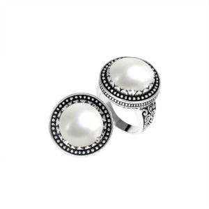 Sterling silver handcrafted Bali ring with Mother of Pearl cabochon and beaded halo design.