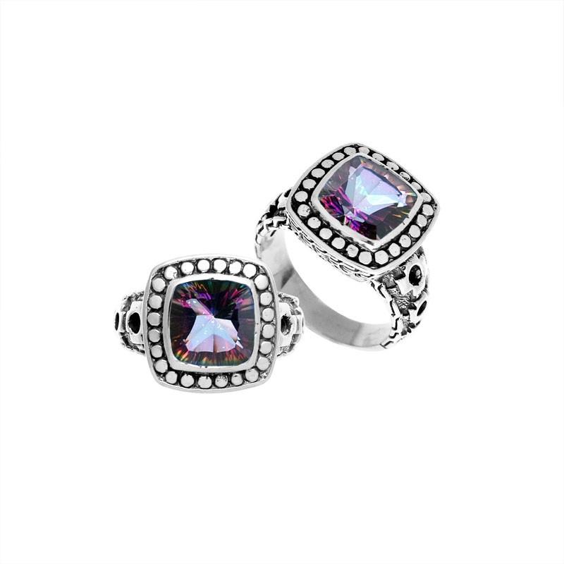 Wholesale sterling silver ring with cushion-cut Mystic Quartz in rainbow hues and dotted bezel design.