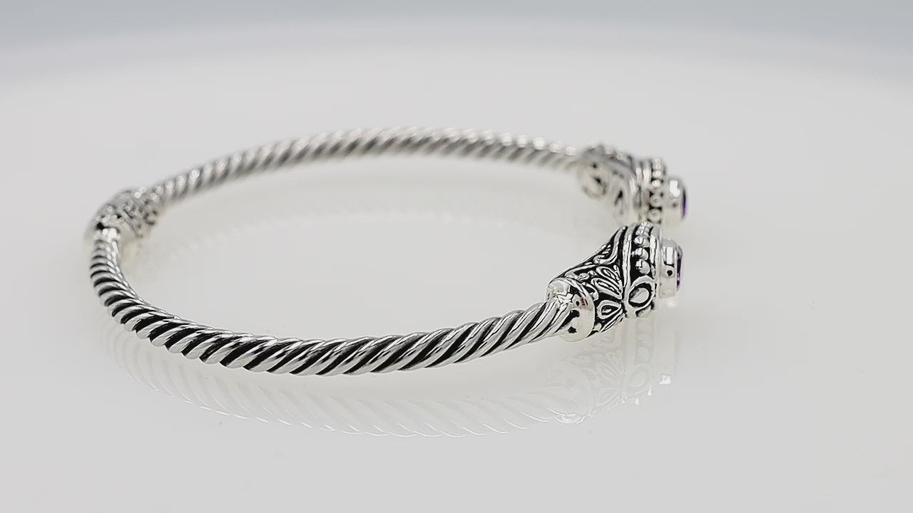 Silver twisted cable bangle in 925 sterling silver with Blue Topaz Quartz and Balinese engraving.