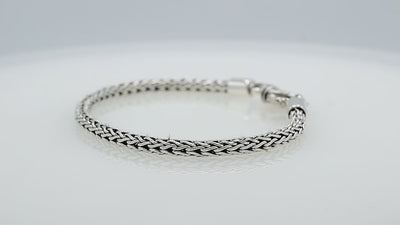 Wholesale sterling silver bracelet featuring a 4MM artisan-woven chain design with polished oxidized details and a decorative lobster lock for secure fastening.