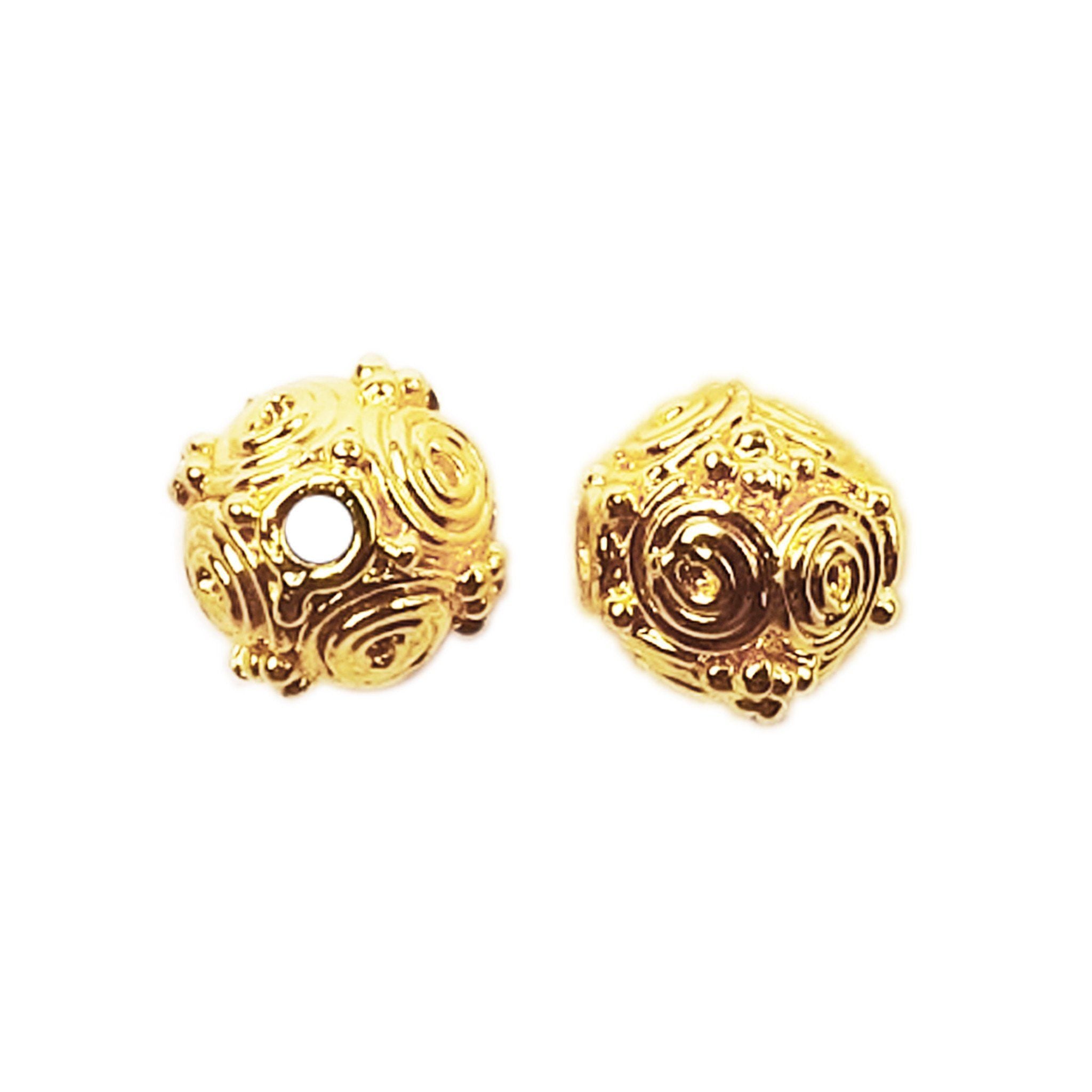 Filigree round bead with spiral details in 18K gold overlay over copper, handcrafted in India.