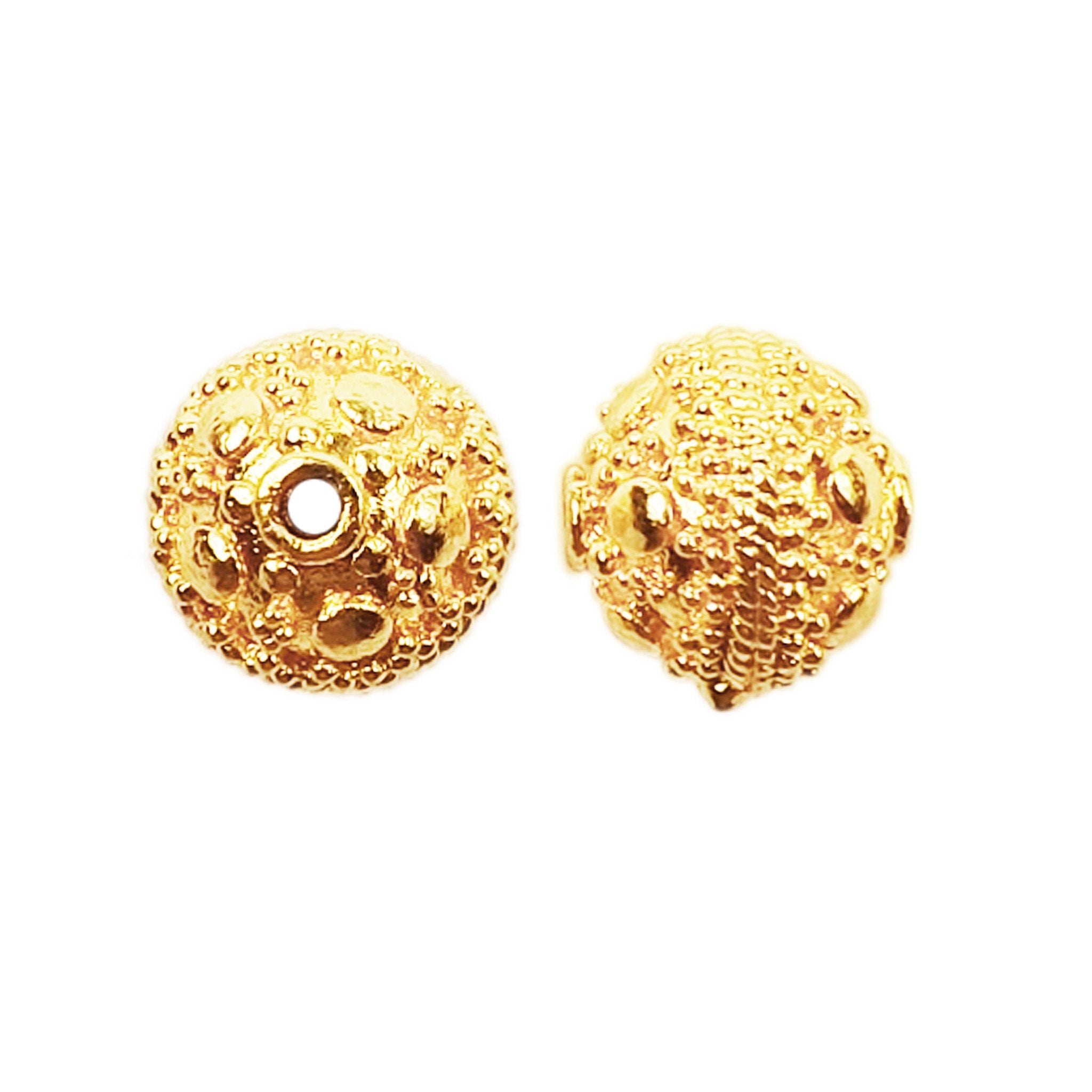Handcrafted granulated embossed round bead with 18K gold overlay over copper, made in India for wholesale jewelry manufacturing.