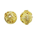 Handcrafted swirl-pattern engraved round bead with 18K gold overlay over copper, made in India for wholesale jewelry production.