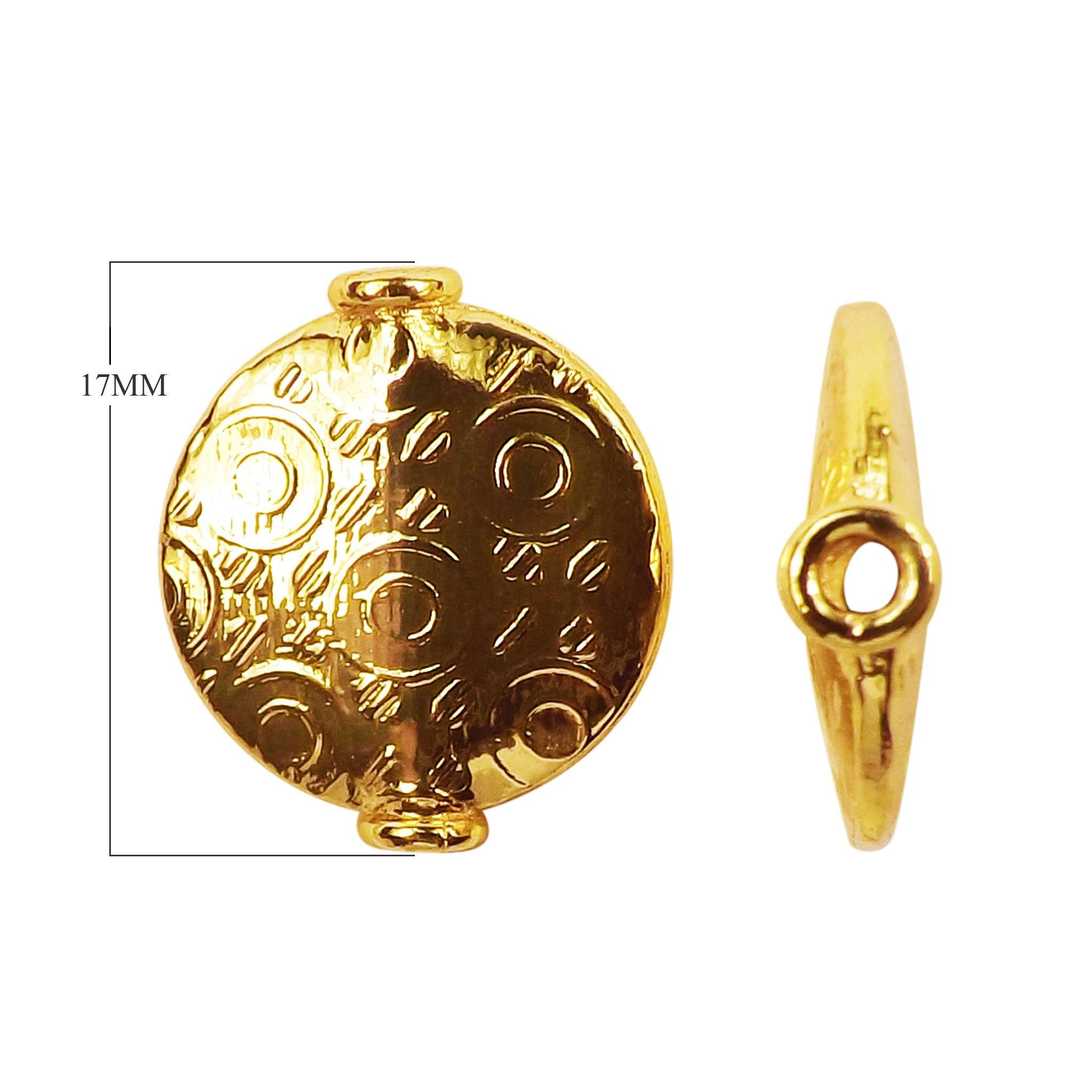 Handcrafted flat disc bead with embossed circular pattern and 18K gold overlay over copper, made in India for wholesale jewelry production.
