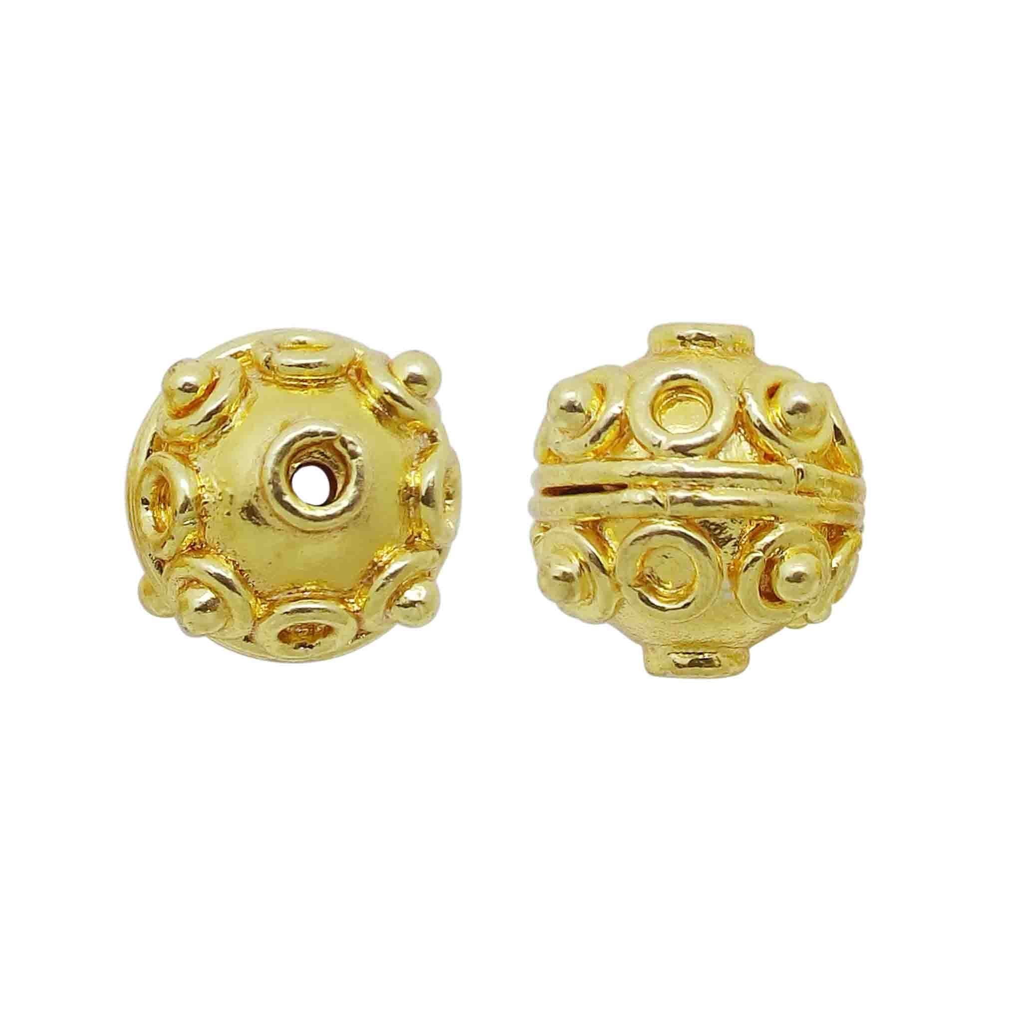 Handcrafted embossed ring-motif round bead with 18K gold overlay over copper, made in India for wholesale jewelry production.
