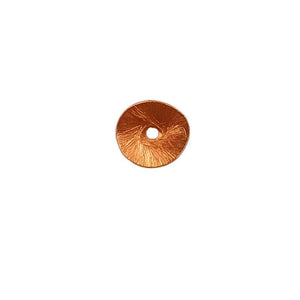 Rose gold overlay over copper textured disc handcrafted in India for wholesale metal components