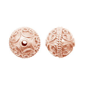 Rose gold overlay over copper swirl design round bead handcrafted in India for wholesale jewelry manufacturing