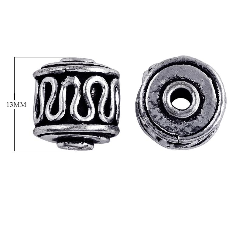 Silver overlay over copper barrel bead from India with oxidized silver wave design for wholesale jewelry making