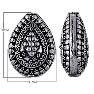 Silver overlay over copper handcrafted teardrop bead from India with floral dotted design and antique finish