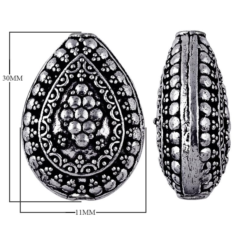 Silver overlay over copper handcrafted teardrop bead from India with floral dotted design and antique finish