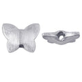 Handcrafted silver overlay over copper butterfly shaped accent bead made in India with textured finish