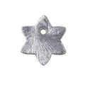 Handcrafted silver overlay copper textured star charm from India with polished finish for wholesale jewelry and craft use