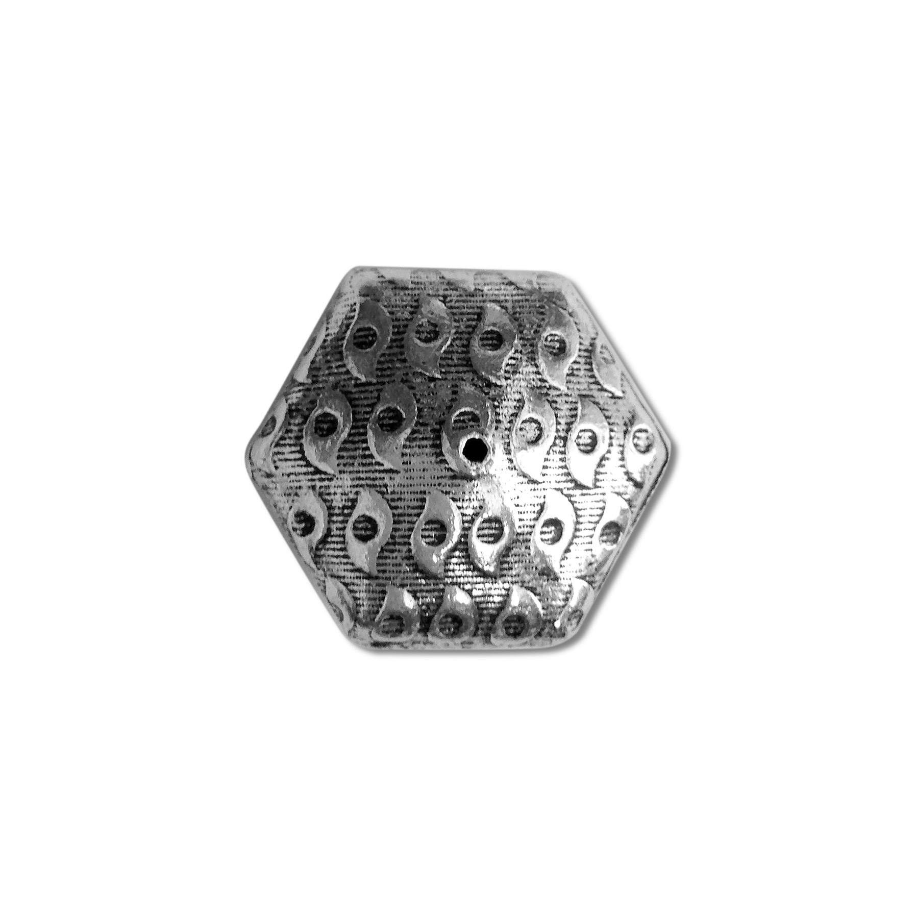 Handcrafted hexagon bead cap with silver overlay over copper, featuring engraved motif texture and oxidized finish, made in India.
