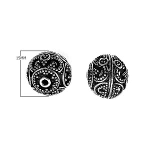 Handcrafted granulated round silver overlay over copper bead with curved Indian design