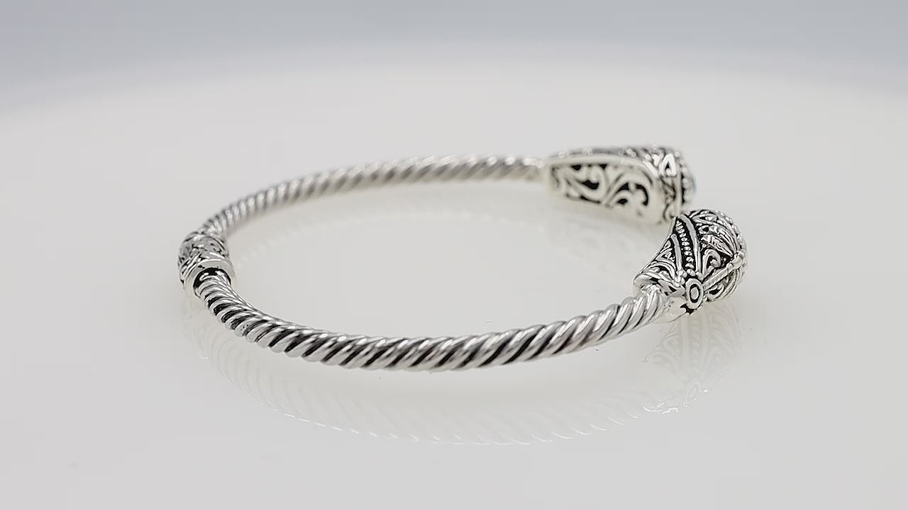 Silver twisted cable bangle in 925 sterling silver with Amethyst Quartz ends and Balinese engraving.