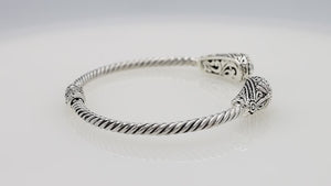 Silver twisted cable bangle in 925 sterling silver with Amethyst Quartz ends and Balinese engraving.
