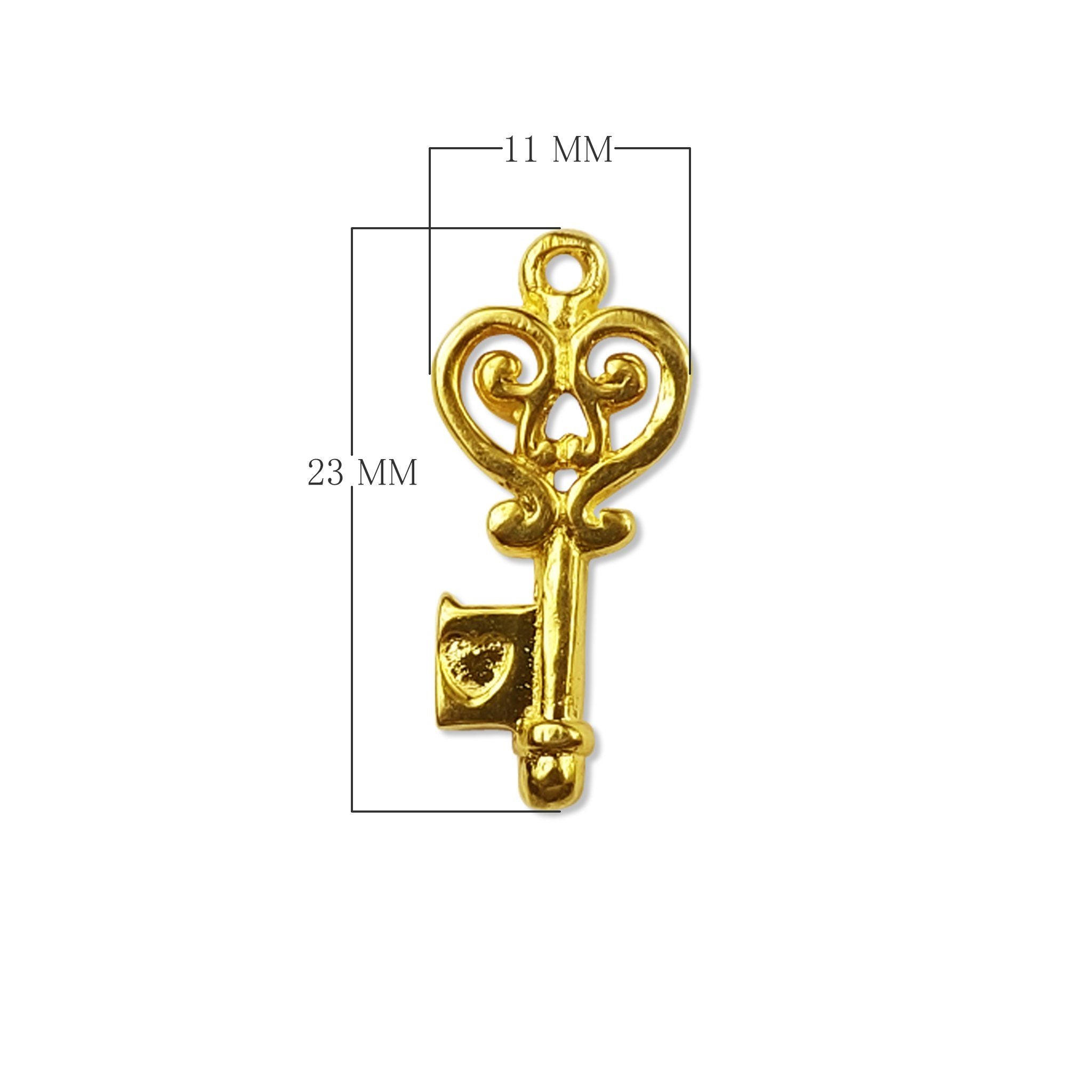 Vintage ornate key charm made with 18K Gold Overlay Over Copper, handcrafted in India for wholesale jewelry production.