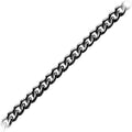 Curb link chain made with Black Rhodium Overlay Over Copper featuring polished dark finish, tightly interlocked flattened links, and durable construction sold per foot for wholesale jewelry manufacturing