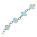 Silver overlay over copper appetite beading chain with polished finish and soft blue nugget shaped beads displayed for wholesale jewelry manufacturing use