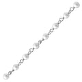 Silver overlay over copper mabe pearl beading chain with polished finish and smooth round pearl beads displayed for wholesale jewelry manufacturing use
