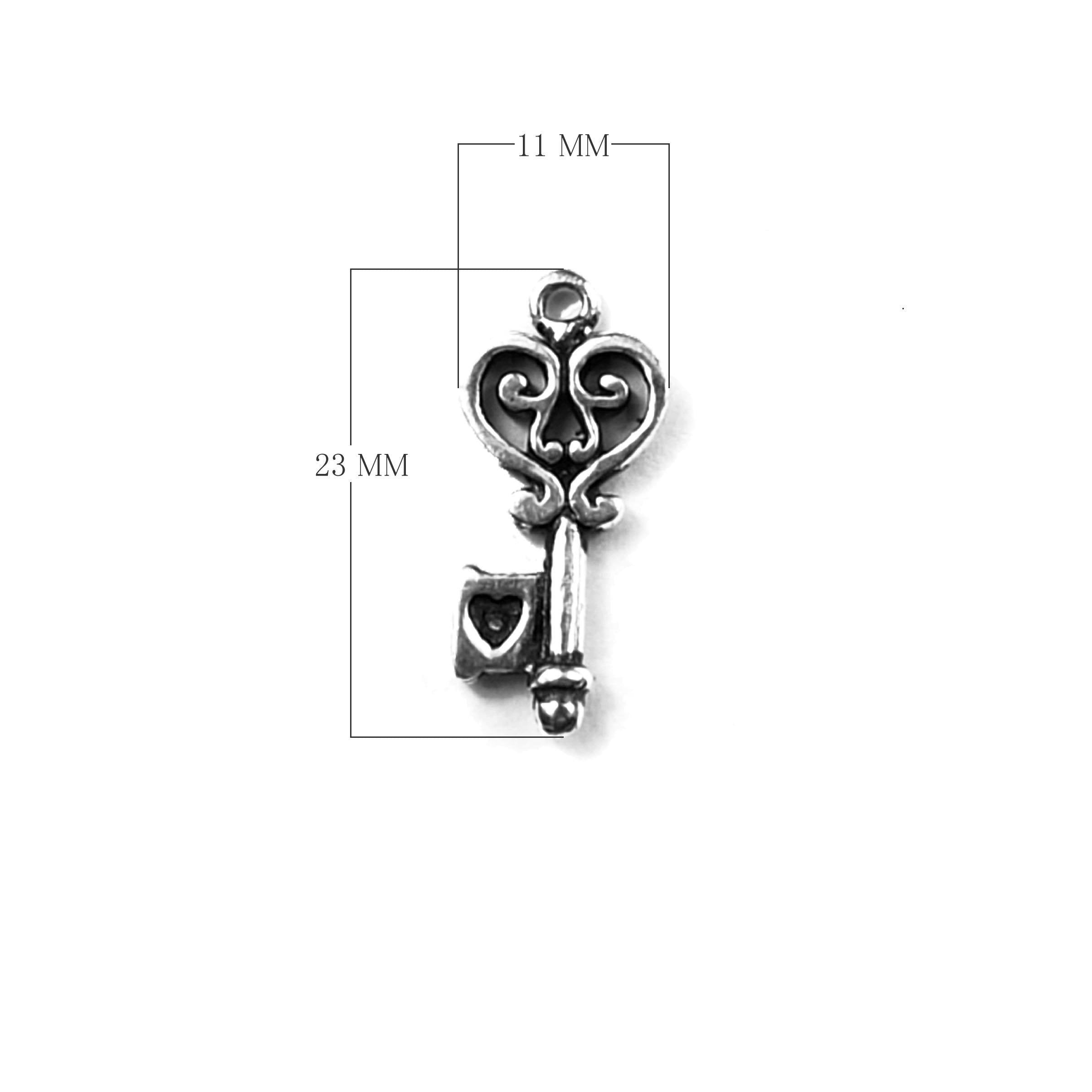Handcrafted Silver Overlay Over Copper ornate key charm pendant with heart detail and oxidized finish made in India.