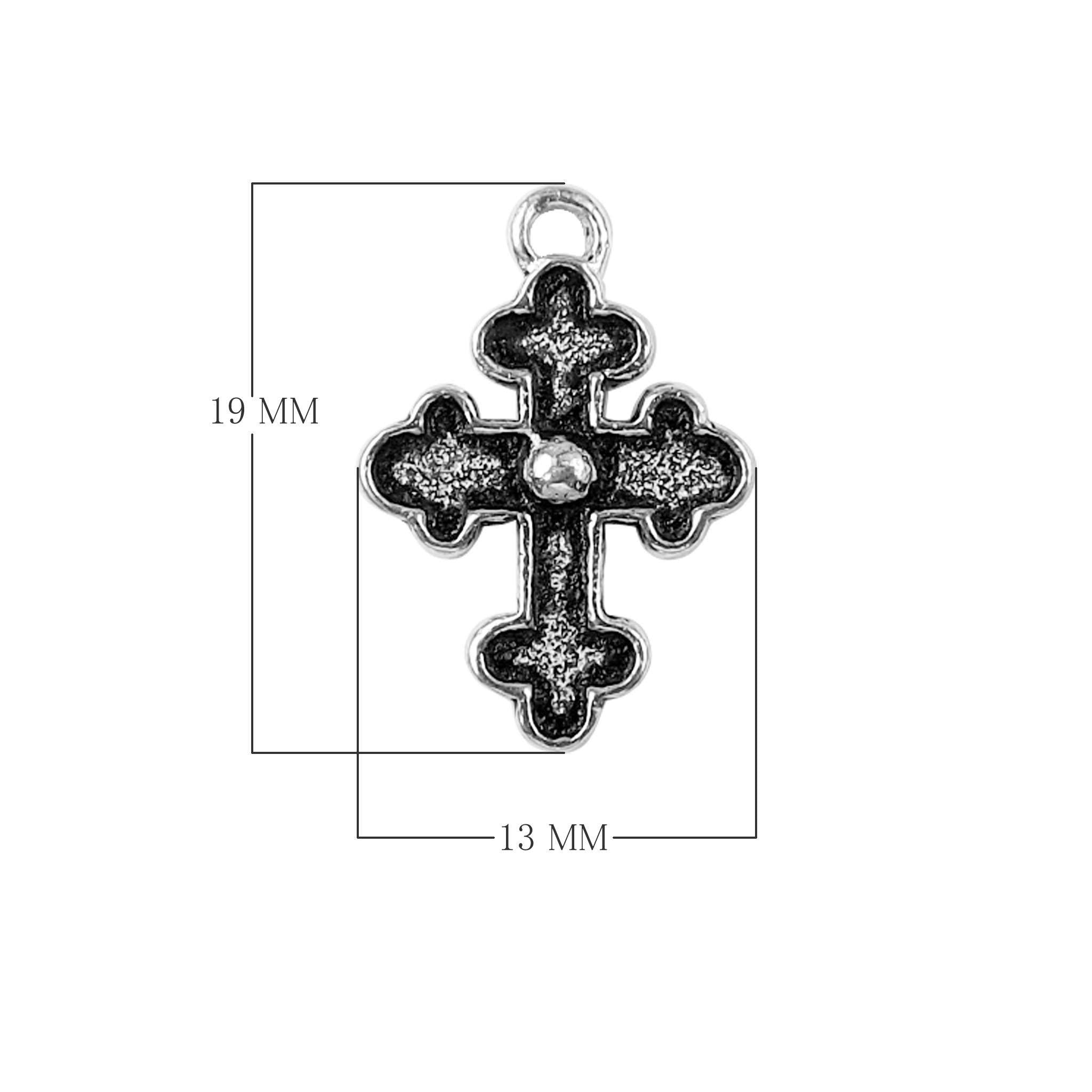 Handcrafted silver overlay decorative cross charm with center bead made of silver overlay over copper in India.