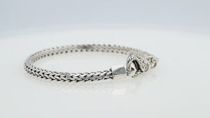 Wholesale sterling silver bracelet featuring a detailed 6MM Balinese woven chain with polished and oxidized accents secured by a sturdy lobster clasp.