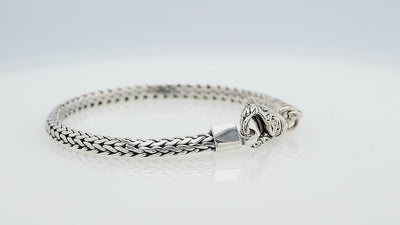 Wholesale sterling silver bracelet featuring a detailed 6MM Balinese woven chain with polished and oxidized accents secured by a sturdy lobster clasp.