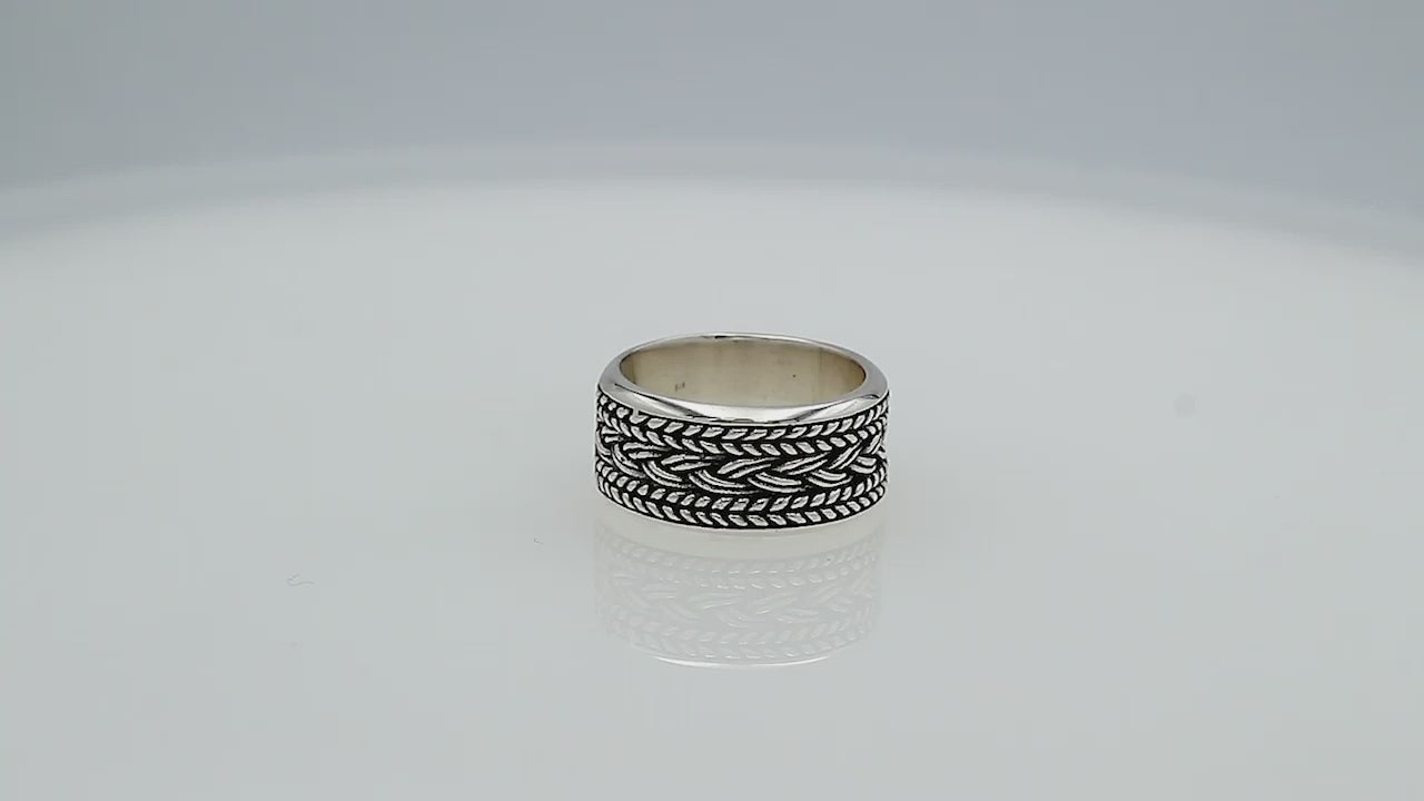 Wholesale sterling silver wide band ring with intricate braided Bali-inspired design and oxidized details, handcrafted unisex artisan jewelry in bulk for retailers and resellers.