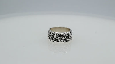 Wholesale sterling silver wide band ring with intricate braided Bali-inspired design and oxidized details, handcrafted unisex artisan jewelry in bulk for retailers and resellers.